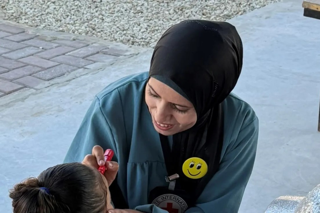 A doctor taking children through recreational activities to support mental health at the Gaza