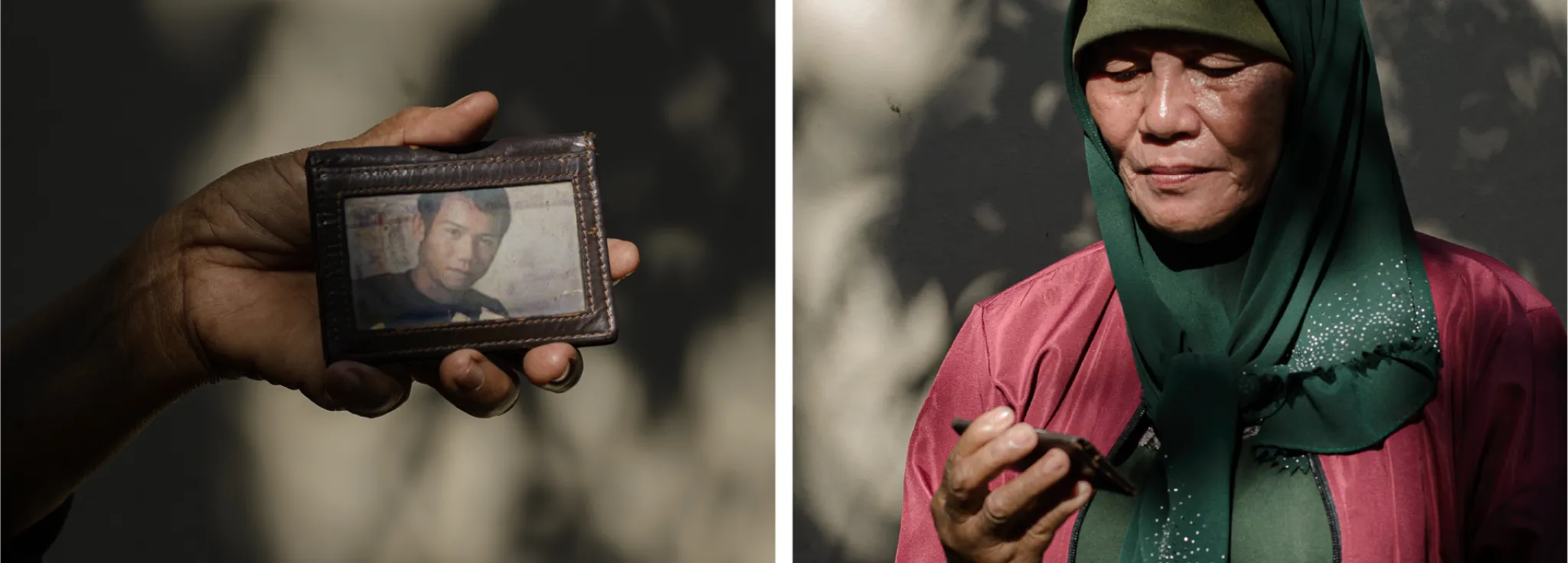 A woman holidng a picture of a young man in her wallet