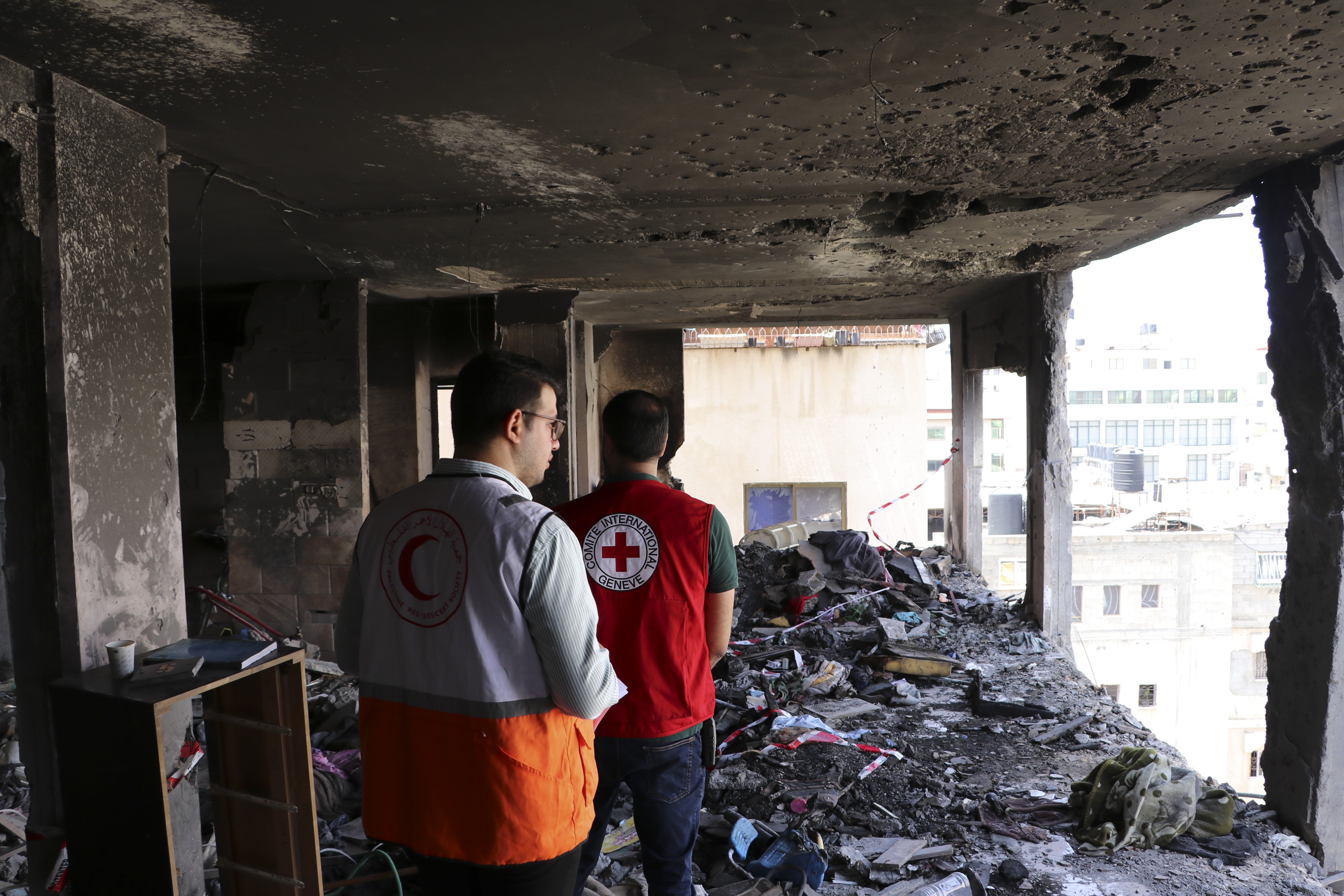 Two colleagues, working at Gaza, examine the ongoing situations. ICRC, Red Cross